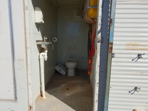 Portable crib room on skid with shower